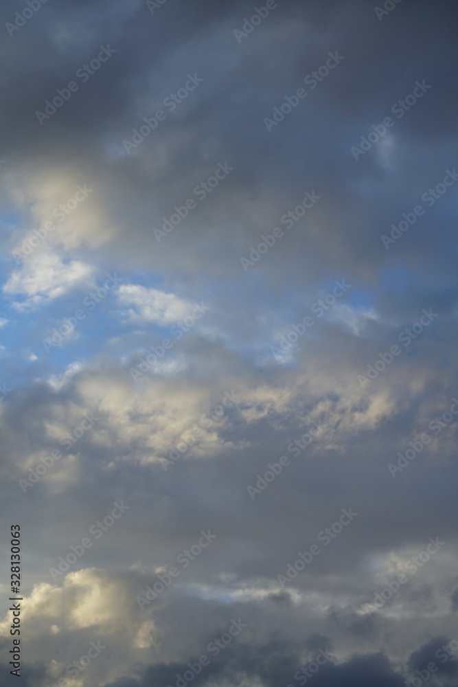 Clouds with sunlight and blue color during evening sunset 