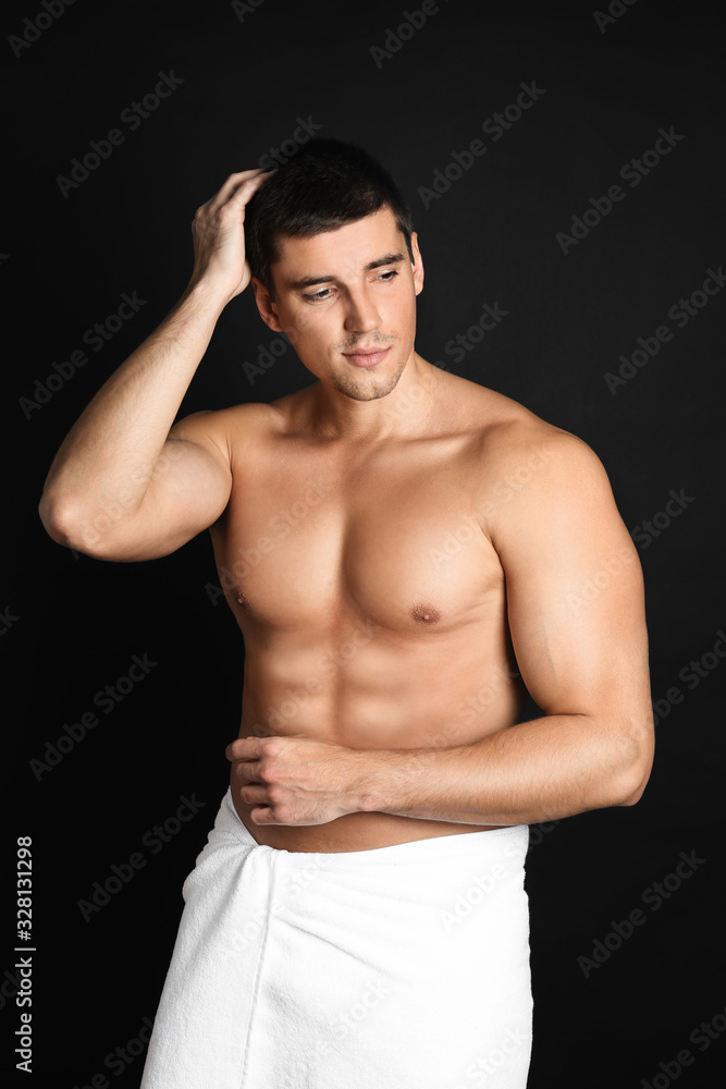 Fototapeta premium Man with sexy body on black background