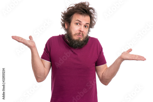 Crazy Bearded Man with funny Haircut showing helpless gesture with arm and hands - I do not know. Male isolated on white background. Shrugging, confused guy making helpless sign and looking at camera.