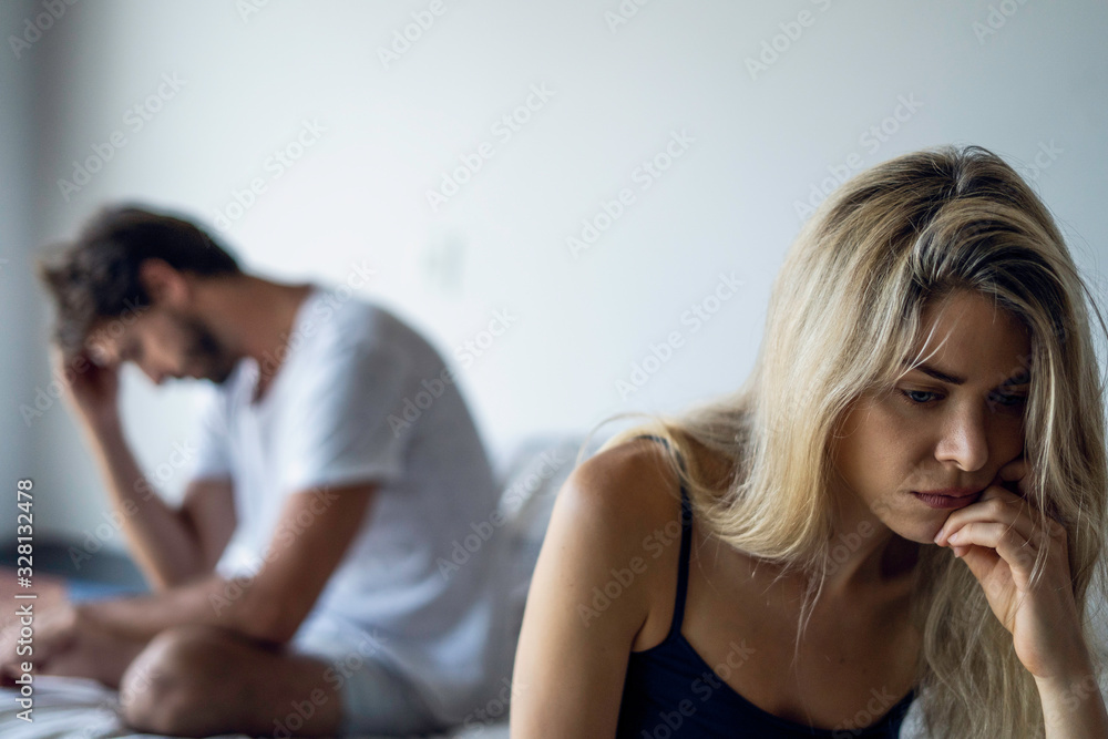 Upset young couple having problems in bedroom Upset young couple having problems in bedroom