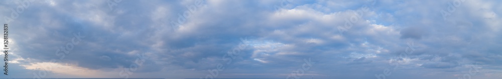 Large panorama of evening sunset sky with beautiful clouds. - obrazy, fototapety, plakaty 