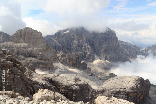 Mountain alps panorama in Brenta Dolomites with clouds, Italy