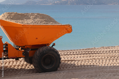 Orange Tractor on the beach in Cannes