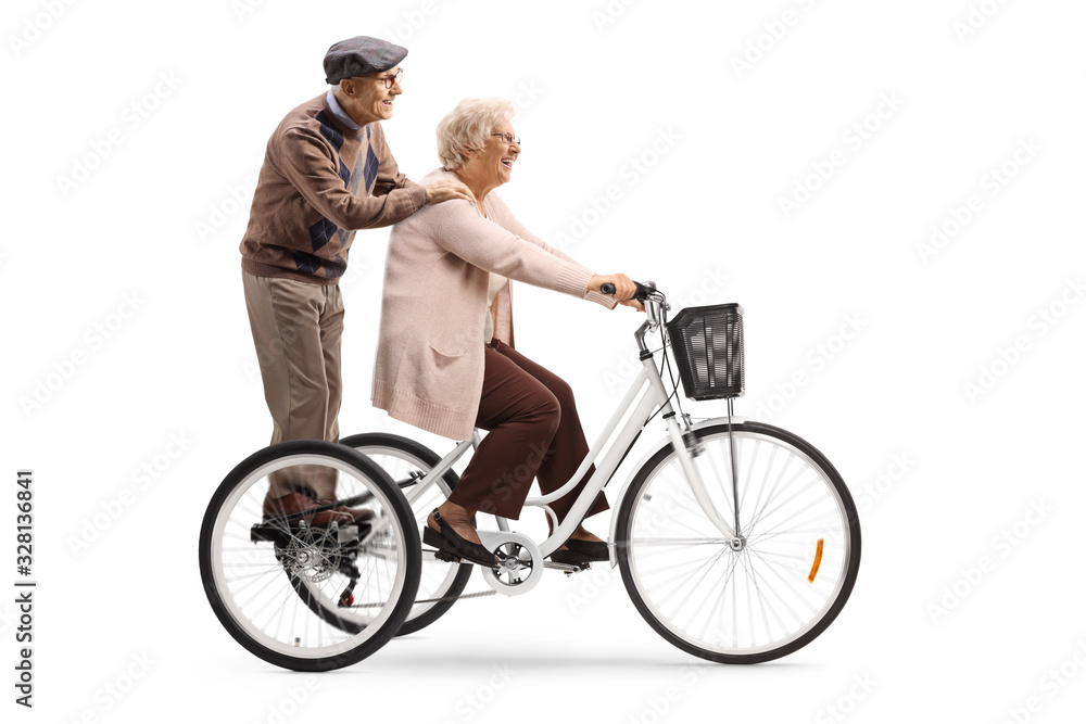 Elderly couple on a tricycle Elderly couple on a tricycle