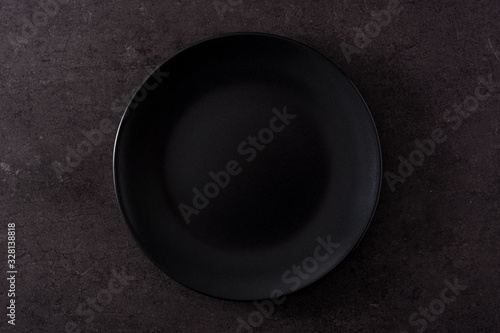Black plate on black slate top view