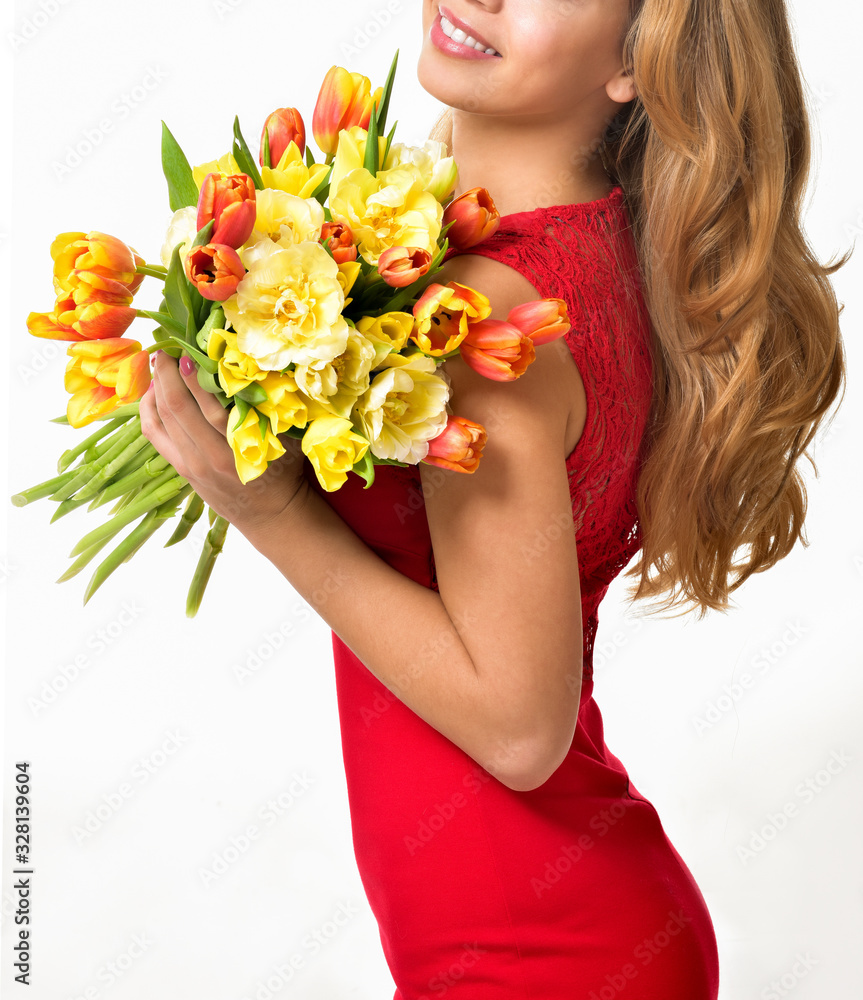 Woman with Spring Flower bouquet. Happy surprised model woman smelling flowers. Mother's Day. Springtime
