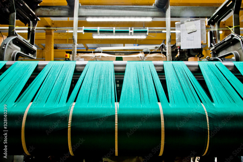 Textile industry with knitting machines in factory - italian - made in Italy