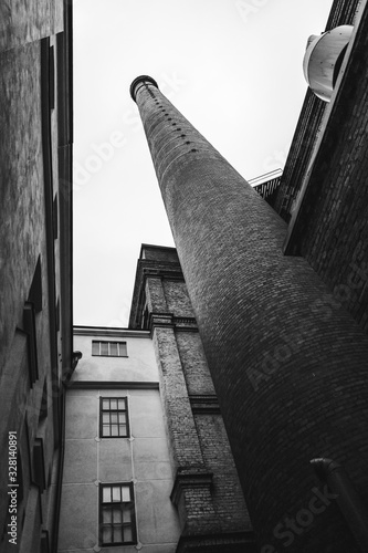 Old pipe from Tampere in the street in black and white.