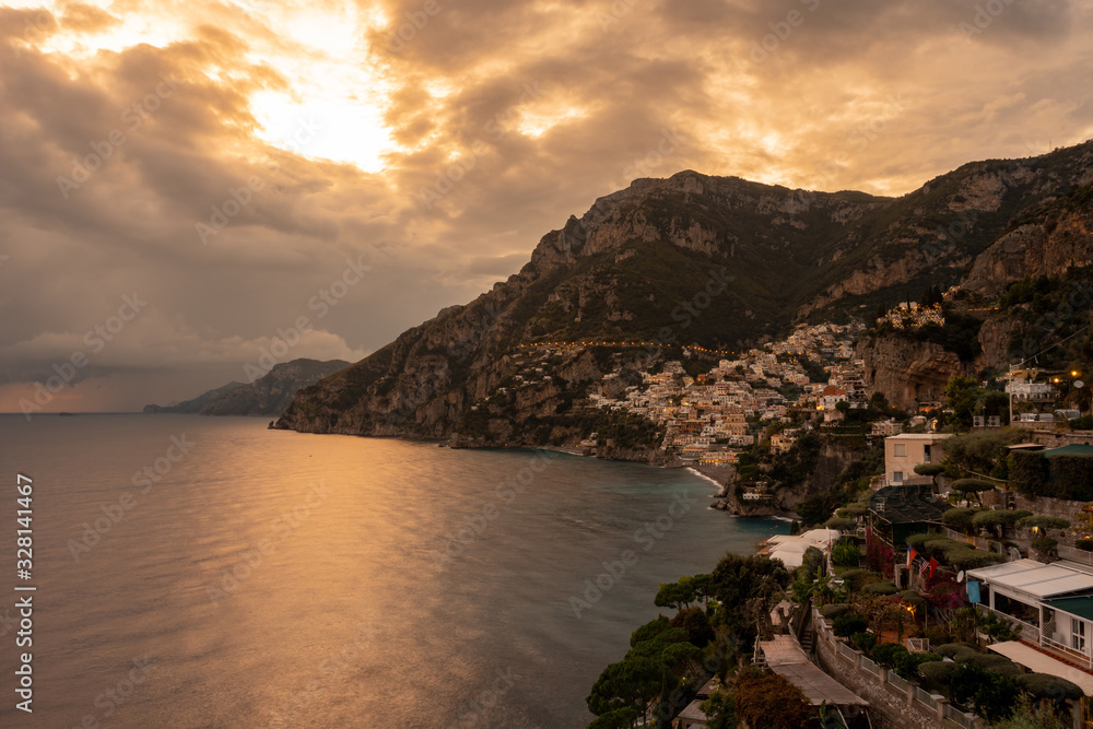 Landscape with Positano town at famous amalfi coast at sunset, Italy