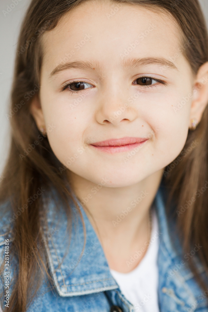 Portrait of a c little cute girl with dark long hair Portrait of a c little cute girl with dark long hair