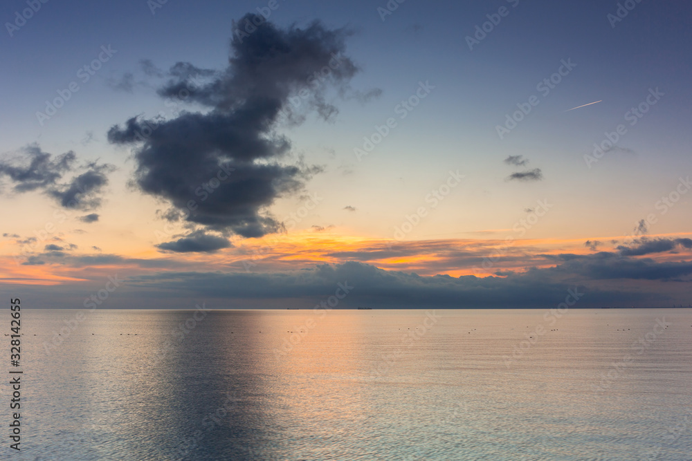 Obraz premium Beautiful sunrise over calm Baltic Sea in Poland