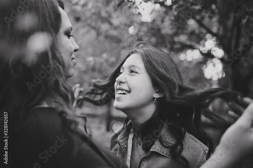 Black and white portrait of a young mother and a young girl
