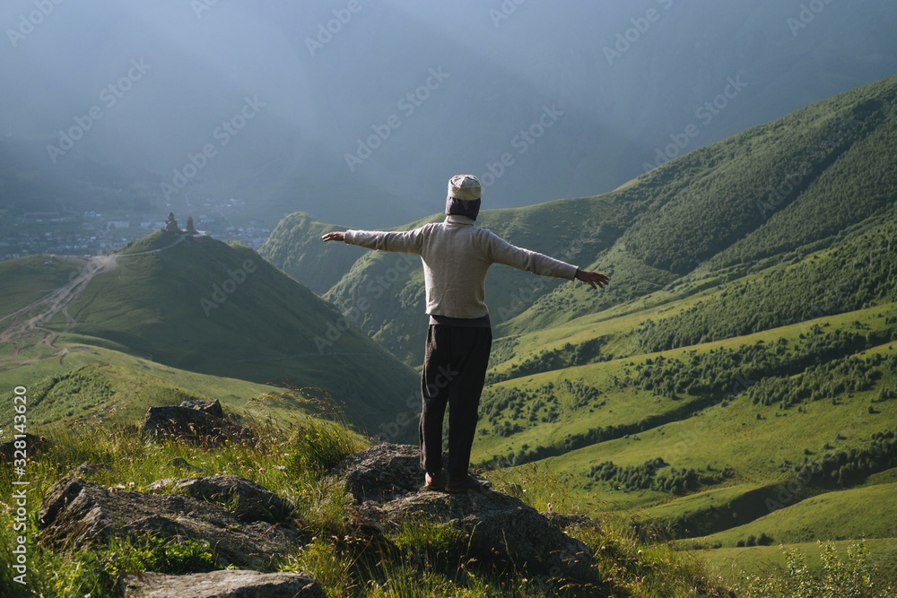Man stands in mountain area Man stands in mountain area