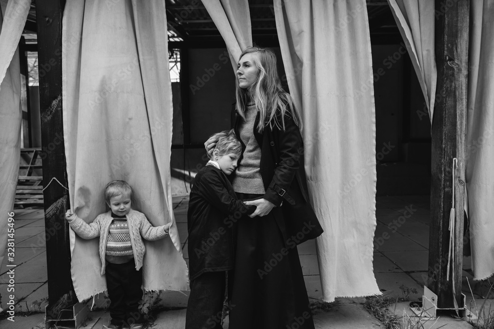Woman and children in curtains Woman and children in curtains