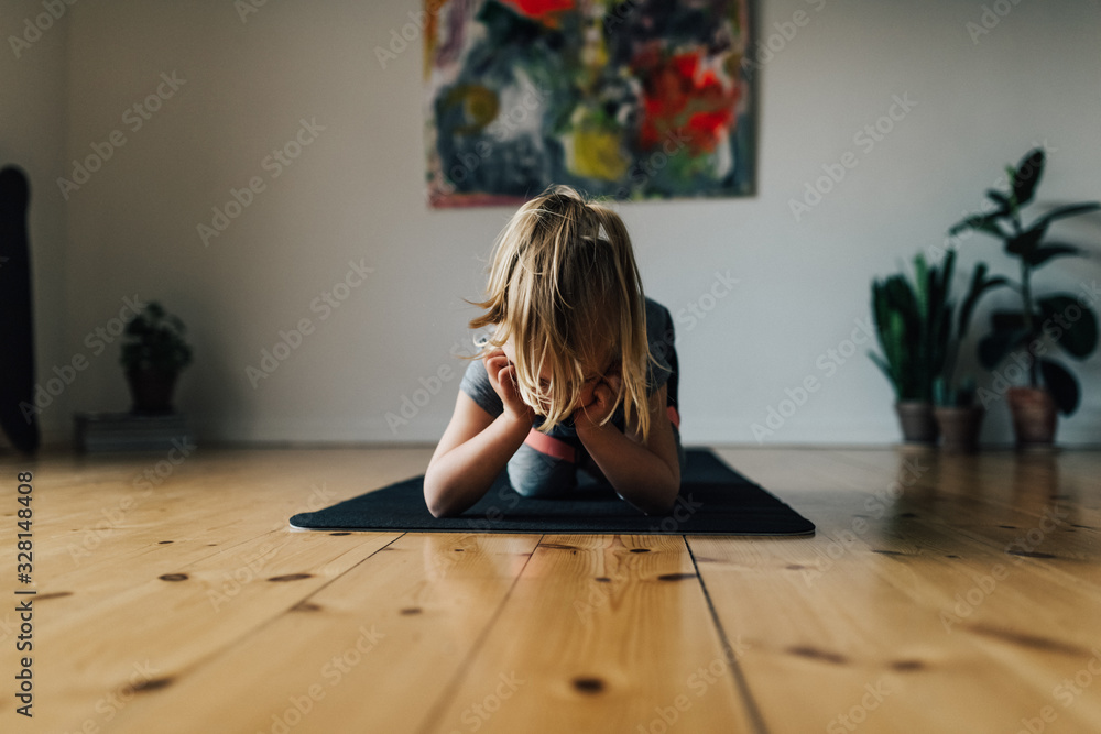 Little girl taking a break from spot exercise Little girl taking a break from spot exercise