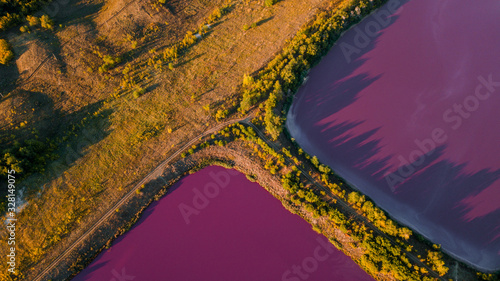 pink chemical lakes with a narrow path in-between