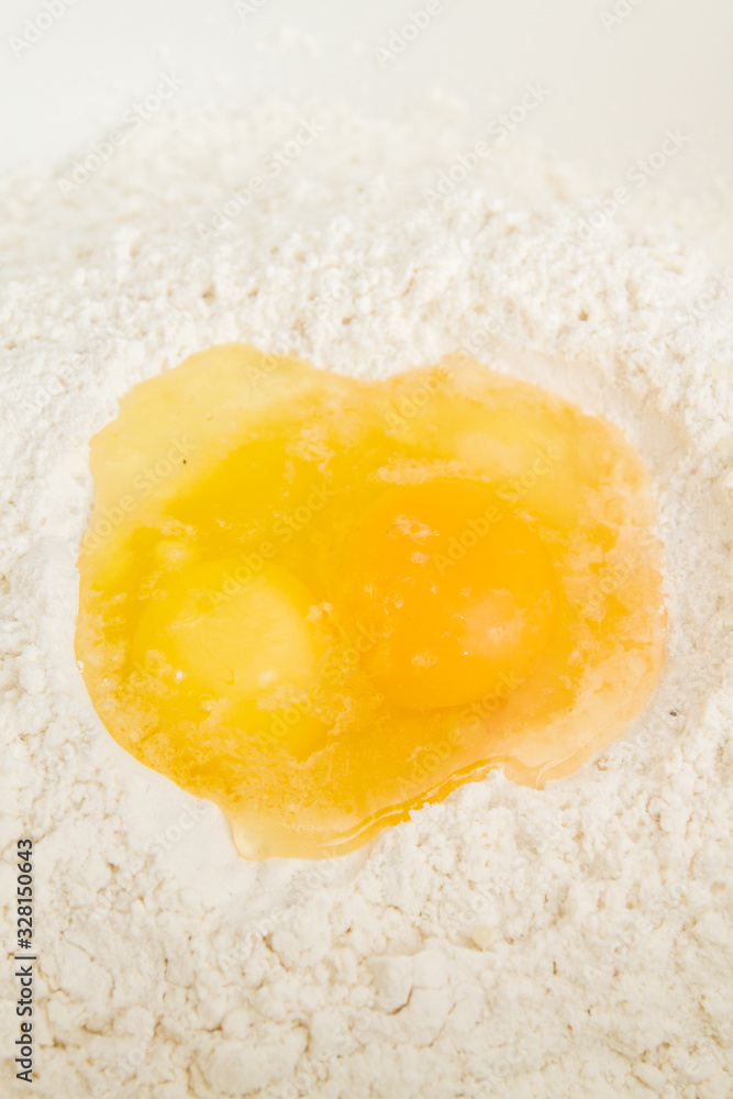 Cooking dough in a white plastic bowl at home Cooking dough in a white plastic bowl at home