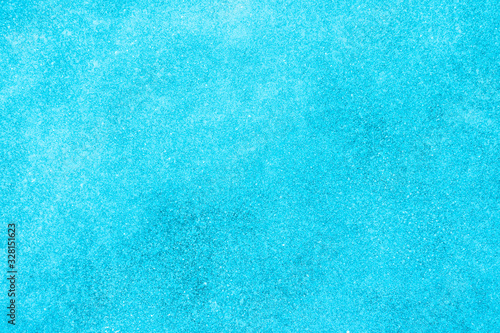 blue texture of an snow surface with pure ice white wave , blue cold clear cryslallized wall background ,decorative plaster background close up , abstract macro wallpaper