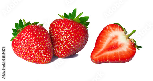 Fototapeta Naklejka Na Ścianę i Meble -  Isolated strawberries. Fresh fruits, one cut in half on white background