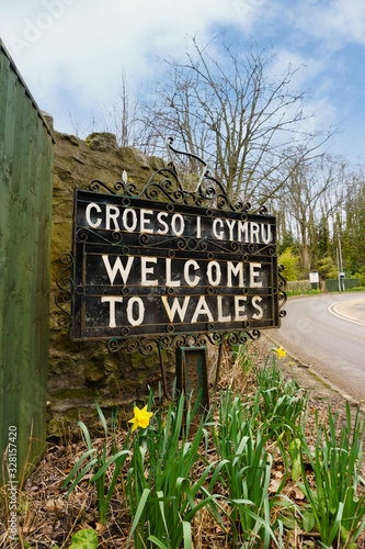 Welcome to Wales sign in Welsh and English marking the border between England and Wales at the town of Chirk UK