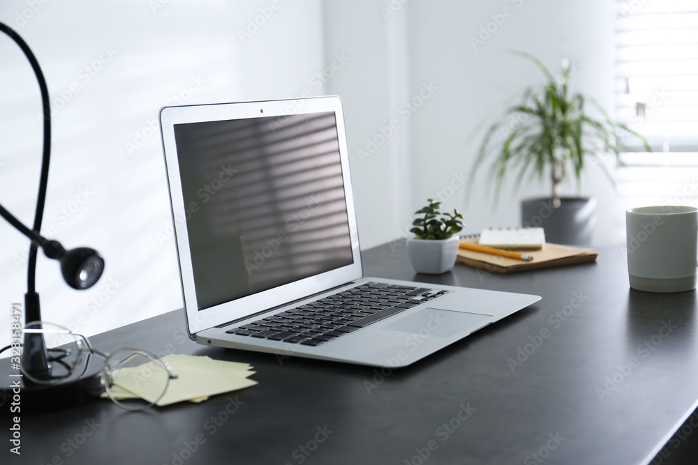 Modern laptop on office table. Stylish workplace Modern laptop on office table. Stylish workplace