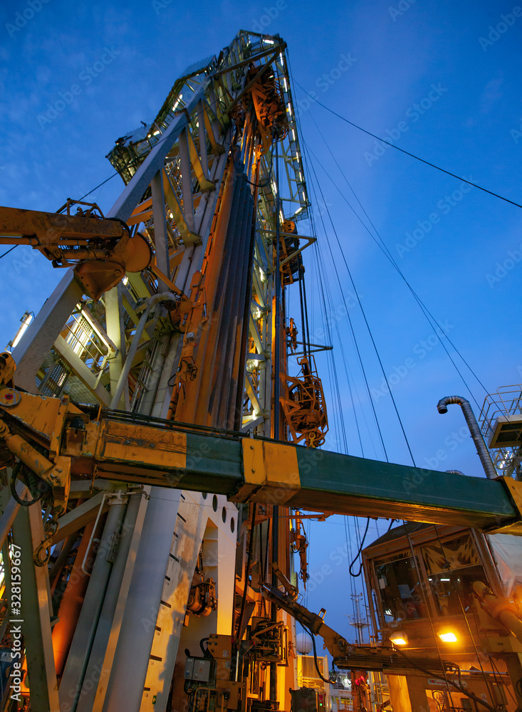Offshore Drilling during sunset in the Gulf of Mexico Offshore Drilling during sunset in the Gulf of Mexico