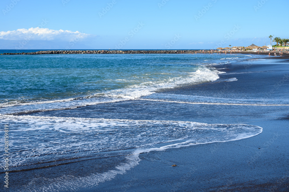 All year sun vacation destination, blue ocean water on  beach Playa del Duque in Costa Adeje, Tenerife island, Canary, Spain