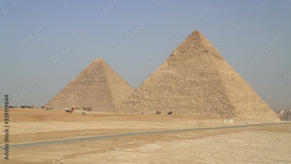 Panoramic view of Giza Pyramids located on the Giza plateau in greater Cairo, Egypt Panoramic view of Giza Pyramids located on the Giza plateau in greater Cairo, Egypt