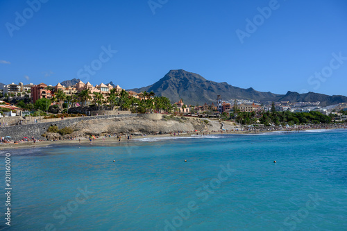 Fototapeta Naklejka Na Ścianę i Meble -  All year sun vacation destination, blue ocean water on  beach Playa del Duque in Costa Adeje, Tenerife island, Canary, Spain