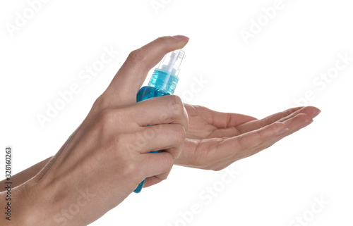 Woman applying antiseptic gel on white background, closeup