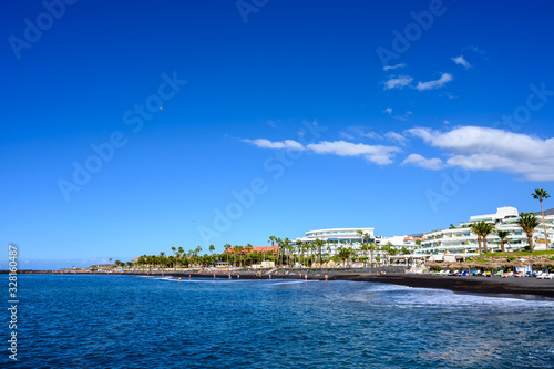 All year sun vacation destination, blue ocean water on beach Playa del Duque in Costa Adeje, Tenerife island, Canary, Spain