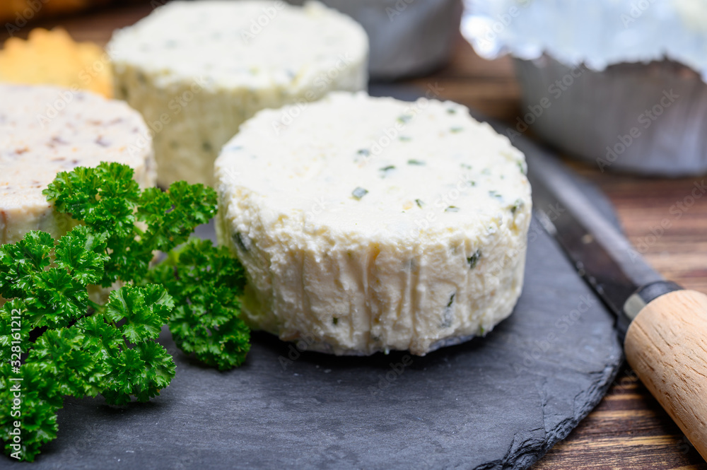 Spread cream cheese with herbs, garlic, chives and spices close up Spread cream cheese with herbs, garlic, chives and spices close up