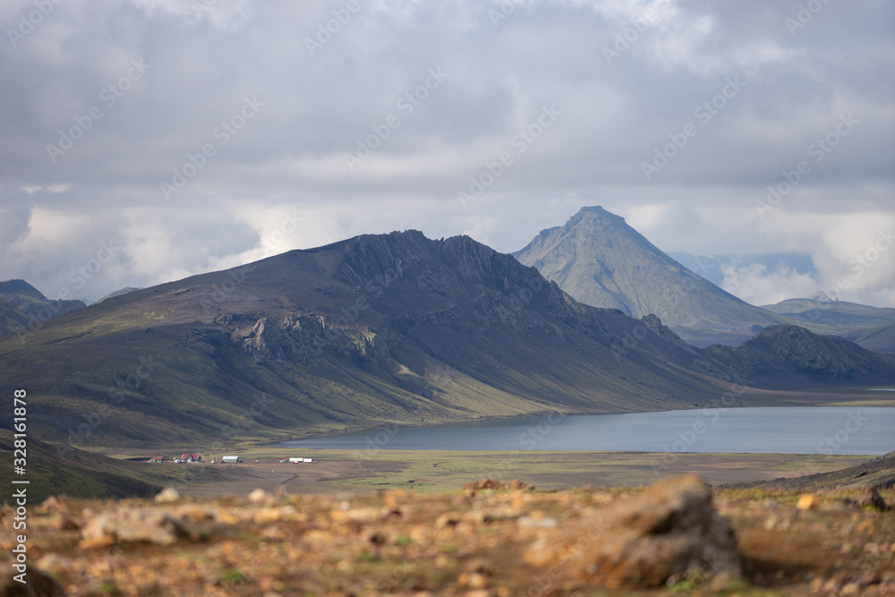 View on Hvanngil mountain hut and camp site with green hills, river stream and lake. Laugavegur hiking trail, Iceland View on Hvanngil mountain hut and camp site with green hills, river stream and lake. Laugavegur hiking trail, Iceland