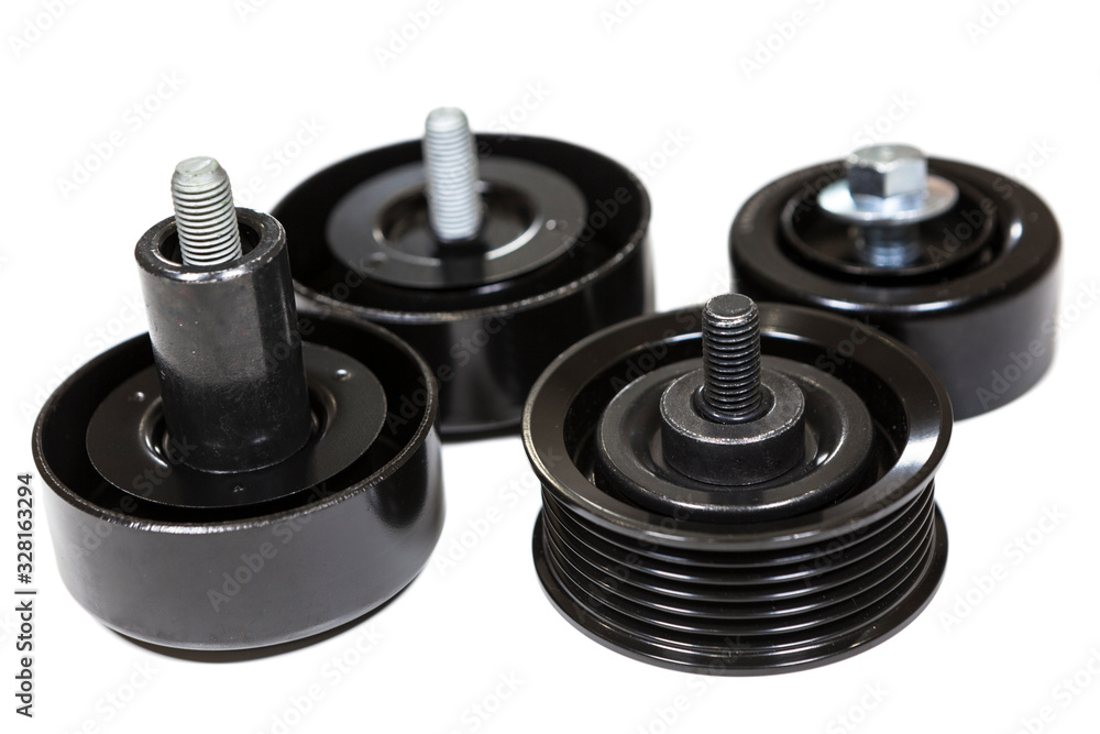 Different rollers for car engine as idler pulley, jockey roller, gallow pulley. Isolated on white background Different rollers for car engine as idler pulley, jockey roller, gallow pulley. Isolated on white background