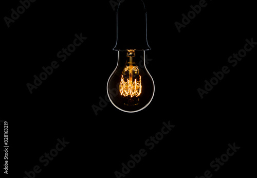 Old retro bulb isolated on a black background
