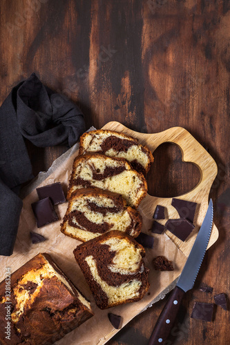 Delicious homemade marble pound cake  on wooden background, top view