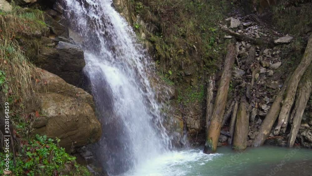 Motion Blur Waterfalls Peaceful Nature Landscape in Mountains. Waterfall at small river near Rosa Khutor resort in Caucasus mountains. Motion Blur Waterfalls Peaceful Nature Landscape in Mountains. Waterfall at small river near Rosa Khutor resort in Caucasus mountains.