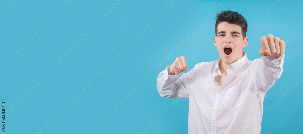 portrait of teenager or male student isolated on color background portrait of teenager or male student isolated on color background