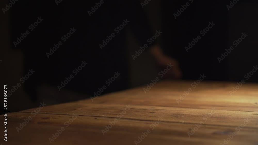 Grabbing a bottle of hand sanitizer gel from a table