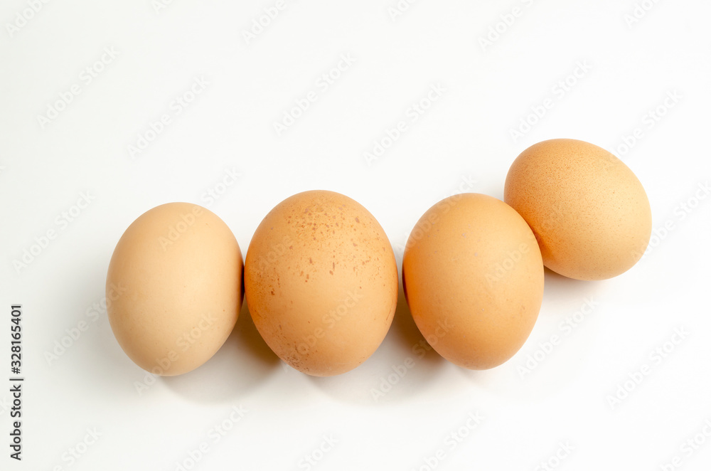 group of fresh chicken eggs on a white background group of fresh chicken eggs on a white background