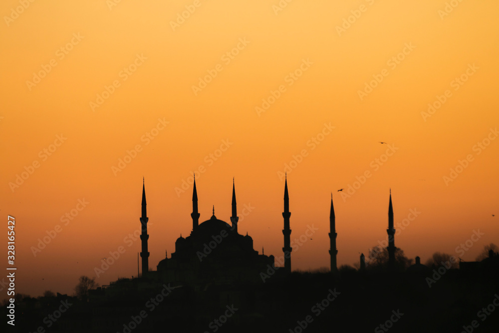 Sunset with sun behind silhouette in Istanbul,Turkey