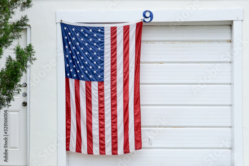 Stars and stripes hanging on garage door in Georgia