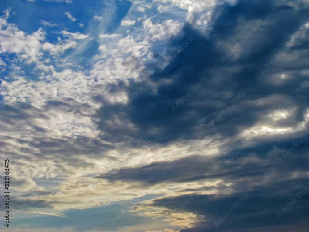 Curly, Dark Gray Cumulus and Thunderclouds Overtake the Azure Sky. They Created a Picturesque Relief Picture Curly, Dark Gray Cumulus and Thunderclouds Overtake the Azure Sky. They Created a Picturesque Relief Picture