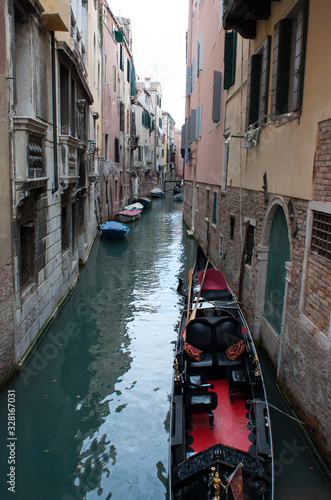 Narrow Venice Canal With Gondola