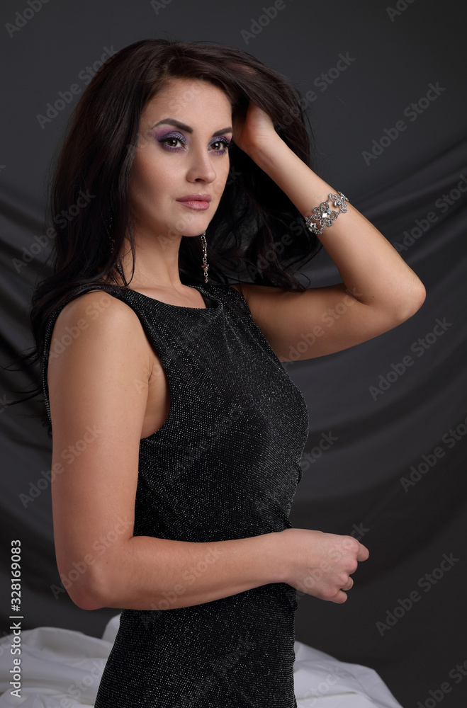 Fototapeta premium Portrait of a beautiful woman in an evening dress