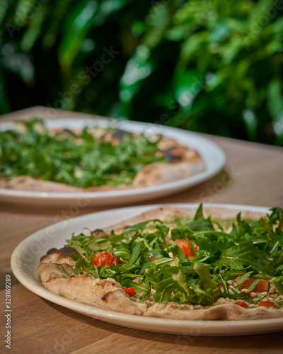 Vegan pizza with fresh arugula