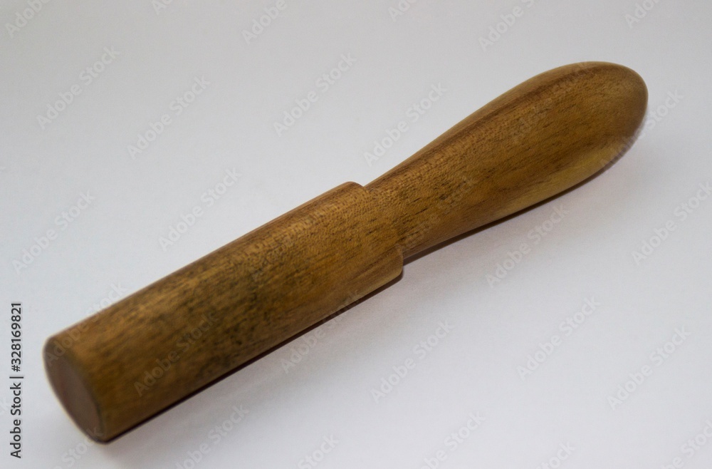 wooden pestle on a white background wooden pestle on a white background