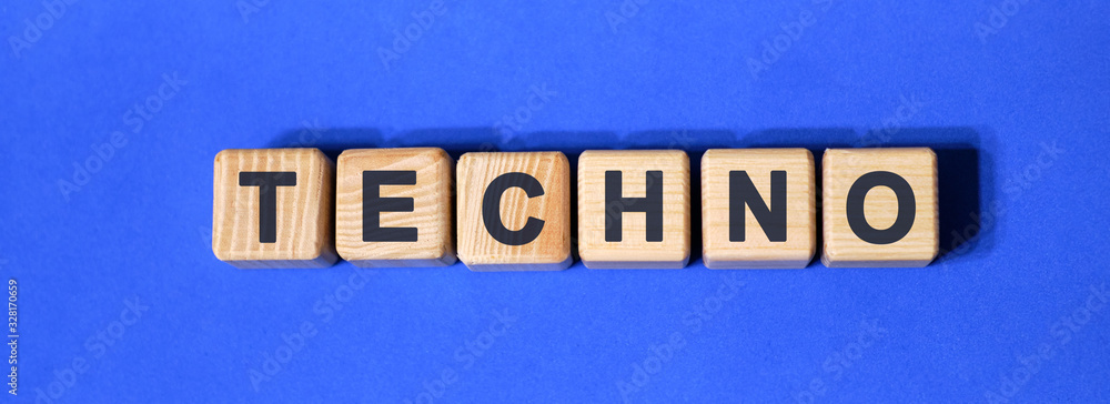 TECHNO on wooden cubes on a blue background TECHNO on wooden cubes on a blue background