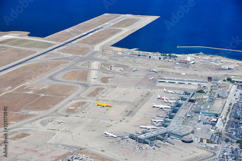 Aerial shot when overflying  the tarmac, runways and terminal of Marseille Provence international airport