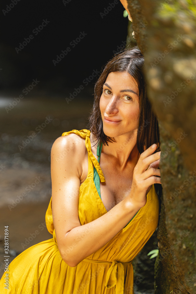 Naklejka premium Positive delighted young beauty posing on camera
